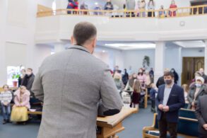 man preaching to congregation